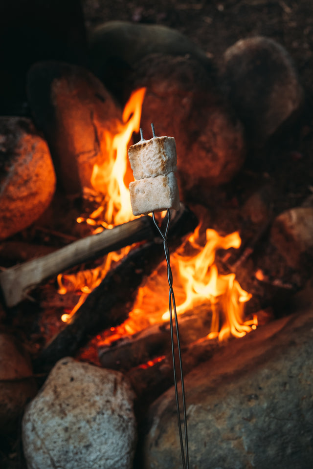 handcrafted gourmet marshmallows toasting over a campfire